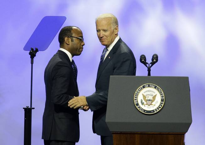 Vice President Joe Biden, right, shakes hands with NAACP President and CEO Cornell William Brooks at the NAACP annual convention Wednesday, July 23, 2014, in Las Vegas.