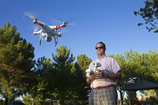 Earl Brown flies his DJI Phantom 2 Vision quadcopter drone at The Hills Park in Summerlin Thursday, July 24, 2014.  Brown turned to Craigslist after losing the drone on a flight earlier in the month.