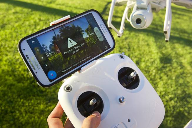 An error message is shown on Earl Brown's smartphone after flying his DJI Phantom 2 Vision quadcopter drone at The Hills Park in Summerlin Thursday, July 24, 2014.  Brown saw a similar message when he lost the drone on a flight earlier in the month.