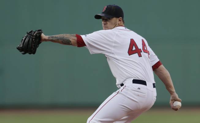 Boston Red Sox starting pitcher Jake Peavy, who has been traded to the San Francisco Giants, throws against the Chicago Cubs during a game at Fenway Park in Boston on Monday, June 30, 2014. 