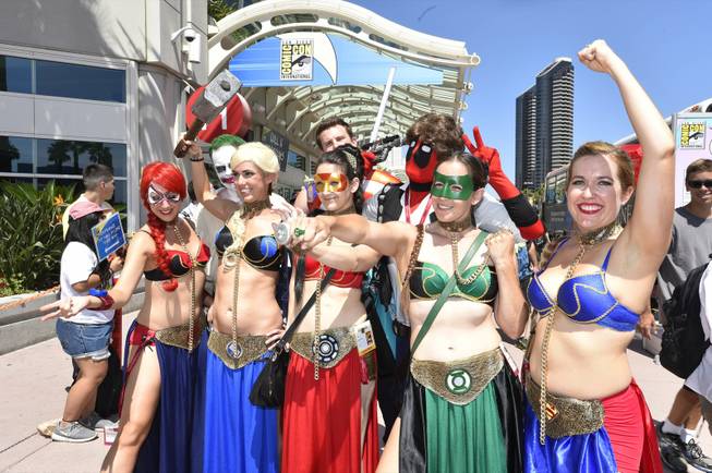 Costumed characters walk outside of the convention center on day 1 of the 2014 Comic-Con International Convention held Thursday, July 24, 2014 in San Diego.