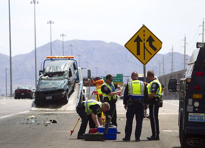 Nevada Highway Patrol troopers pack up after investigating a fatal rollover on Highway 95 southbound at Jones Boulevard Monday, July 28, 2014. A 48-year-old man was ejected from the vehicle and died at the hospital.