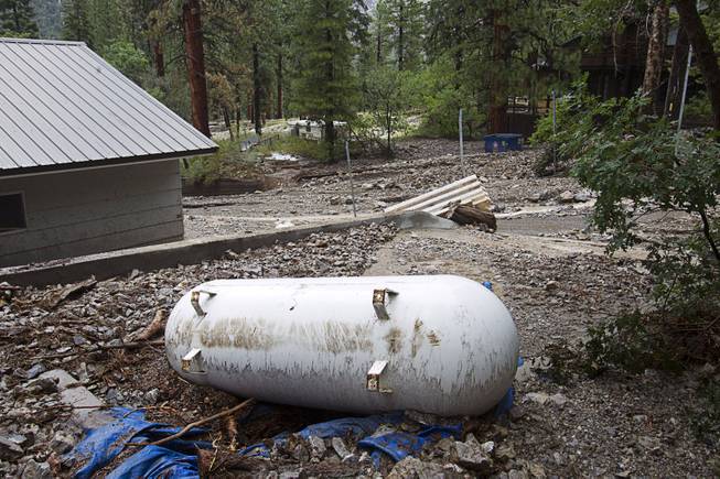 A propane tank is shown by a home in the Rainbow Subdivision on Mt. Charleston Monday, July 28, 2014. The neighborhood was hit hard by flooding and debris in runoff last year as well.