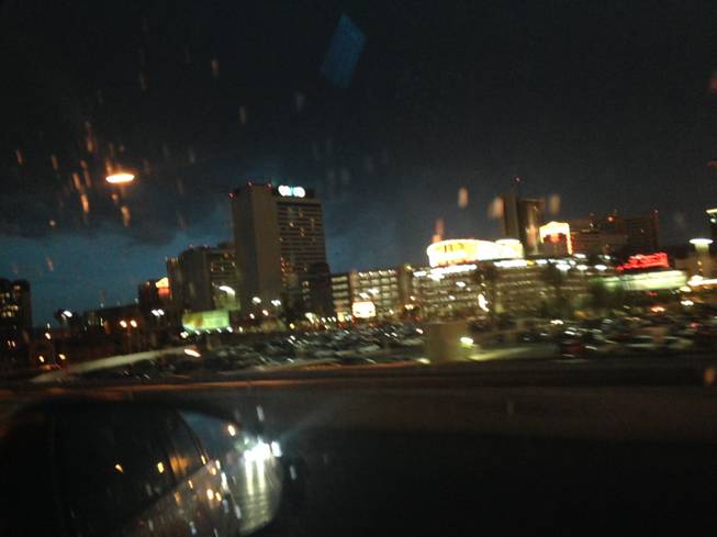 Rain falls in downtown Las Vegas on Sunday night, July 27, 2014. Thunderstorms dumped as much as a half inch of rain in parts of the Las Vegas Valley.