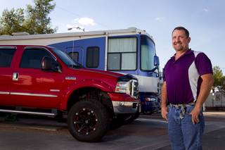 Cass Via, a maintenance worker at the High Roller, poses outside his RV at the Oasis Las Vegas RV Resort Tuesday, July 29, 2014. Via is in the market for a house but says he will be buying a pre-owned home, not a new home.
