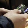 In this May 9, 2012, file photo, a Visa credit card is tendered at the opening of the Superdry store in New York's Times Square. 