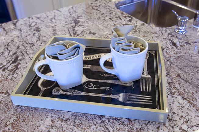 Two coffee cups are shown in the kitchen of a one-story plan 1849 model home at KB Homes' Tevare residential development in Summerlin Wednesday, July 30, 2014.
