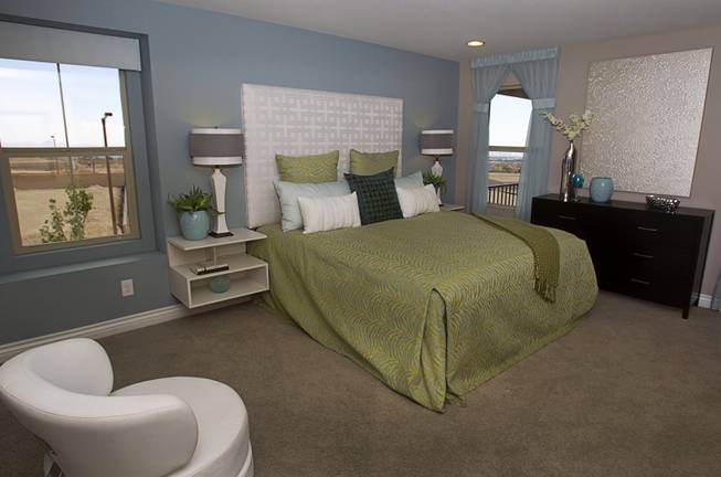 The master bedroom is shown in a two-story plan 2568 model home at KB Homes' Tevare residential development in Summerlin Wednesday, July 30, 2014.