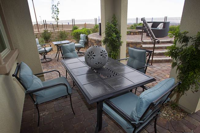 A large patio area is shown in the backyard of a two-story plan 2568 model home at KB Homes' Tevare residential development in Summerlin Wednesday, July 30, 2014.
