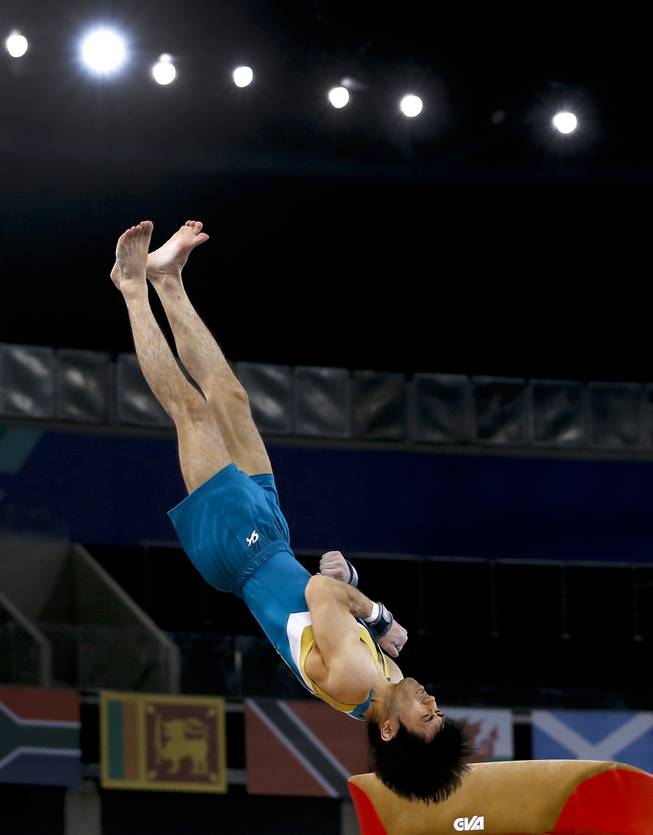 Naoya Tsukahara of Australia performs on the vault during the Men's All-Around gymnastics competition at the Scottish Exhibition Conference Centre during the Commonwealth Games 2014 in Glasgow, Scotland, Wednesday July 30, 2014.