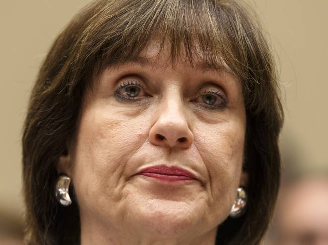  In this May 22, 2013, file photo, Internal Revenue Service official Lois Lerner refuses to answer questions as the House Oversight Committee holds a hearing to investigate the extra scrutiny the IRS gave Tea Party and other conservative groups that applied for tax-exempt status, on Capitol Hill in Washington. 