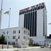 The Trump Plaza towers over Vera Coking's three-story rooming house Wednesday, July 23, 2014, in Atlantic City. The decrepit boarding home owned by the Atlantic City woman who has been turning down multimillion-dollar offers for the building in the shadow of Trump Plaza since the 1980s has been demolished.