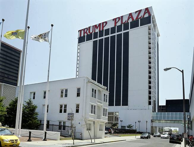 The Trump Plaza towers over Vera Coking's three-story rooming house Wednesday, July 23, 2014, in Atlantic City. The decrepit boarding home owned by the Atlantic City woman who has been turning down multimillion-dollar offers for the building in the shadow of Trump Plaza since the 1980s has been demolished.