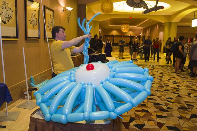 Roger "The Balloon Wizard" Godin creates a model of the USS Enterprise out of balloons during the 13th annual Official Star Trek Convention at the Rio Thursday, July 31, 2014. The convention, expected to attract 15,000 Trekkies, runs through Sunday.