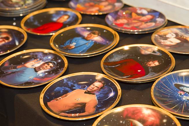 Star Trek collector plates are displayed during the 13th annual Official Star Trek Convention at the Rio Thursday, July 31, 2014. The convention, expected to attract 15,000 Trekkies, runs through Sunday.