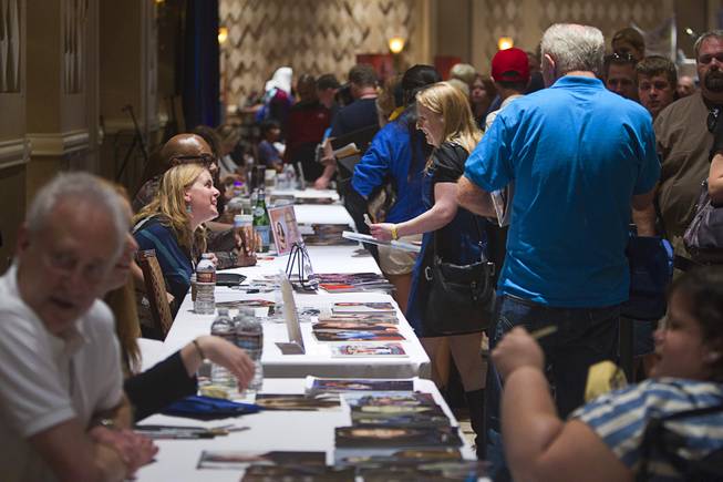 Fans line up to get autographs from Star Trek: The Next Generation actors during the 13th annual Official Star Trek Convention at the Rio Thursday, July 31, 2014. The convention, expected to attract 15,000 Trekkies, runs through Sunday.