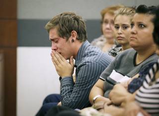 Austin James Lindsey cries while attending the sentencing of his brother Gage James Lindsey in district court Thursday, July 31, 2014, in Las Vegas. Gage James Lindsey was sentenced to 6 to 20 years for for crashing his vehicle into a Las Vegas restaurant in 2013 and injuring 10 people. (AP Photo/John Locher)