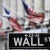 This April 22, 2010, file photo shows a Wall Street sign in front of the New York Stock Exchange. 