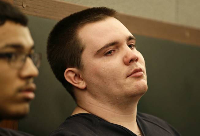 Gage James Lindsey, 20, cries during sentencing in District Court on Thursday, July 31, 2014, in Las Vegas. Lindsey was sentenced to 6 to 20 years for crashing his car into a Las Vegas restaurant in 2013 and injuring 10 people.
