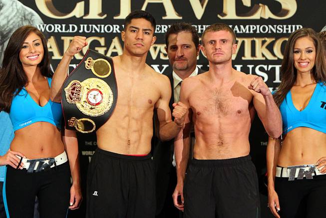 Undefeated WBA Jr. Welterweight champion Jessie Vargas, left, of Las Vegas and undefeated Anton Novikov of Chelyabinsk, Russia pose during an official weigh-in at the Cosmopolitan Friday, August 1, 2014. Vargas will defend his title against Novikov in the Chelsea at the Cosmopolitan Saturday.