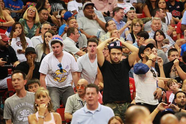 Fans react after Paul George fractured his leg during the 2014 USA Basketball Showcase Friday, Aug. 1, 2014 at the Thomas & Mack Center.
