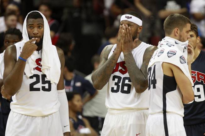 Andre Drummond, DeMarcus Cousins and Chandler Parsons react after Paul George suffered a compound fracture of his lower leg during the 2014 USA Basketball Showcase Friday, Aug. 1, 2014 at the Thomas & Mack Center.