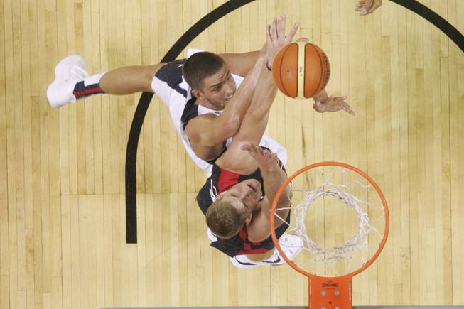 Gordon Hayward, bottom, and Chandler Parsons fight for a rebound during the 2014 USA Basketball Showcase Friday, Aug. 1, 2014 at the Thomas & Mack Center.