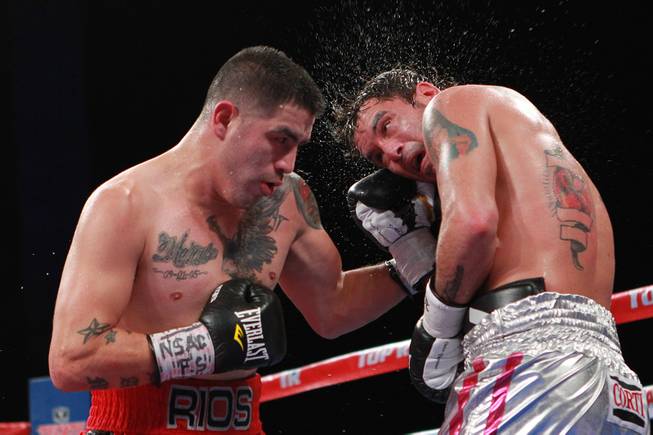 Diego Chaves is hit with a left from Brandon Rios during their welterweight fight Saturday, Aug. 2, 2014 at the Cosmopolitan. Rios won after Chaves was disqualified in the ninth round.