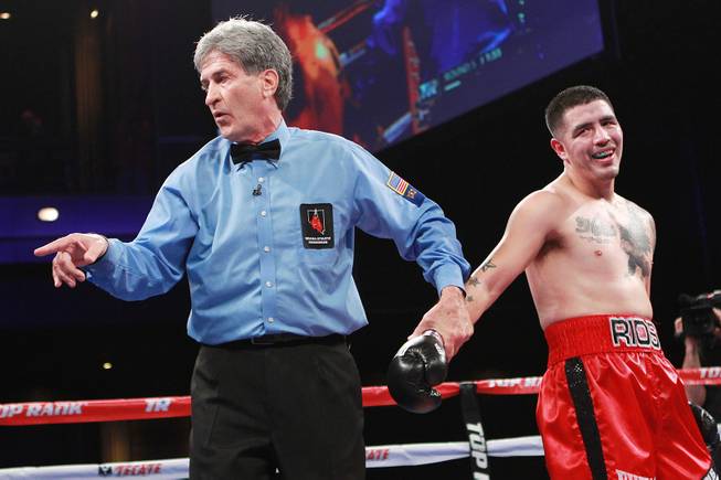 Referee Vic Drakulich deducts a point from Brandon Rios for pushing down Diego Chaves during their welterweight fight Saturday, Aug. 2, 2014 at the Cosmopolitan. Rios won after Chaves was disqualified in the ninth round.