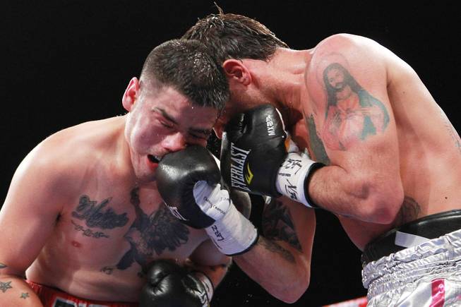 Diego Chaves hits Brandon Rios with a right during their welterweight fight Saturday, Aug. 2, 2014 at the Cosmopolitan. Rios won after Chaves was disqualified in the ninth round.
