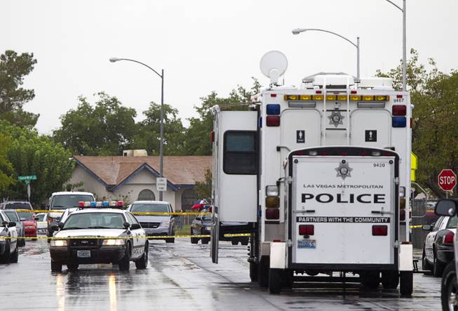 A Metro Police mobile command center is shown at the scene of an officer-involved-shooting near Pecos and Alexander roads August 3 , 2014.