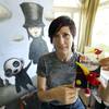 Artist Juli Adams on Tuesday, Aug. 5, 2014, in her home art studio in Seattle with one of her original drawings that a line of plush pet toys called "Angry Birds" was based. 