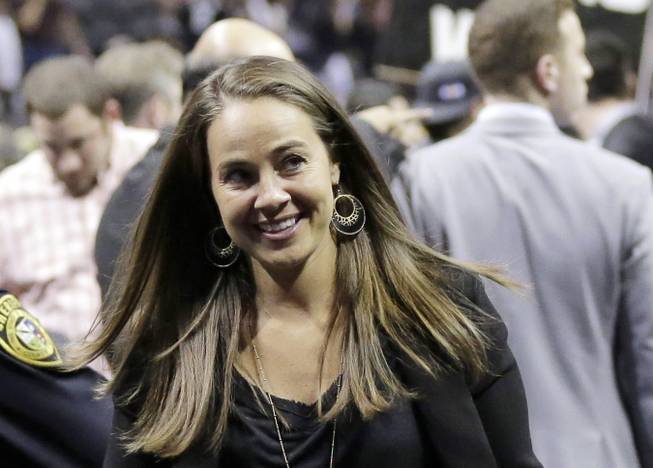 In this April 30, 2014, photo, the San Antonio Stars' Becky Hammon walks off the court after Game 5 of the opening-round NBA playoff series between the San Antonio Spurs and the Dallas Mavericks in San Antonio.