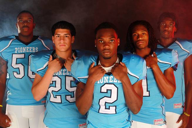 From left, Canyon Springs High School football  players Melvin Johnson, Ezequiel Lopez, Zaviontay Stevenson, Bradley Alexander II and Kajuan Casey July 21, 2014.