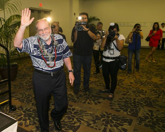 Hawaii Gov. Neil Abercrombie, center, waves to the crowds at the Democratic Unity Breakfast, Sunday, Aug. 10, 2014 in Honolulu. The breakfast is traditionally held after Hawaii elections and is attended by both winners as well as losers. Fellow Democrat and State Sen. David Ige defeated Abercrombie in a stunning primary-election defeat Saturday.