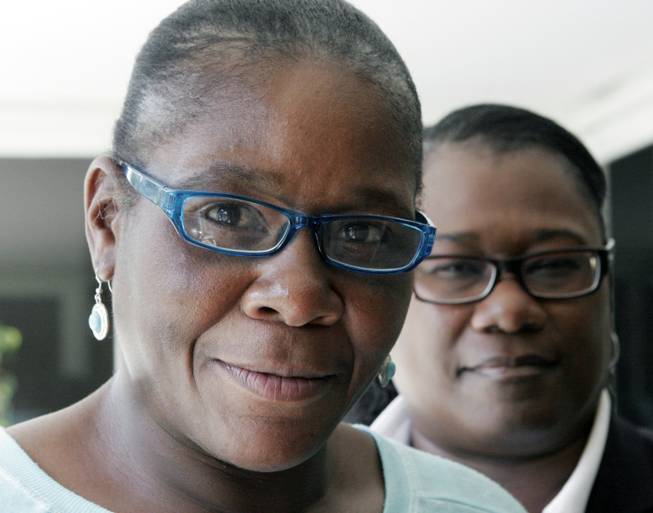 Marlene Pinnock, left, poses with her attorney, Caree Harper during an interview Sunday Aug. 10, 2014 in Los Angeles. Pinnock, a homeless woman was beaten by a CHP officer in July 2014. Sunday was Pinnock's first publicized interview since the incident, that was videotaped.