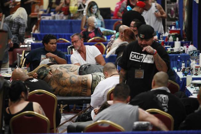 Tattoo artists and aficionados take part in the 3rd annual Art-N-Ink Tattoo Festival Saturday, Aug. 9, 2014 at the South Point.