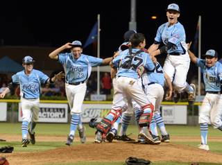 Nevada players celebrate after defeating Pacifica 11-2 Saturday night to win the Little League Western Regional Championship. Mountain Ridge Little League, from Las Vegas, Nevada, defeated Pacifica Little League 11-2 Saturday August 9, 2014 in the Little League Western Regional Championship game at Al Houghton Stadium in San Bernardino. Nevada will play at the Little League World Series in Williamsport, PA. starting next week.  (Will Lester/Staff Photographer)