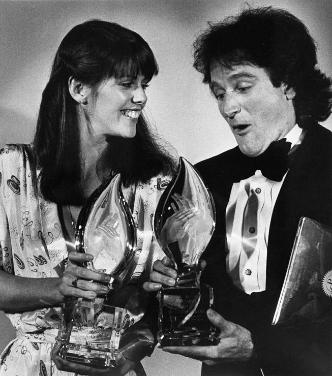 Pam Dawber and Robin Williams hold their People's Choice Awards for "Mork and Mindy" at the awards in Los Angeles on March 8, 1979.

