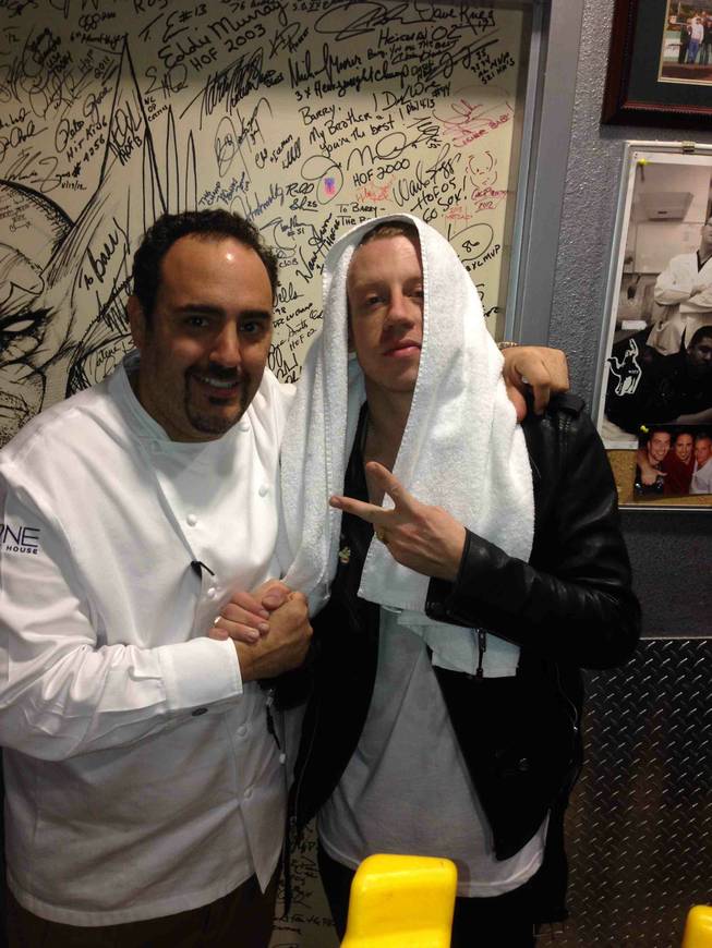 Executive chef Barry S. Dakake, left, of N9NE Steakhouse in the Palms with Macklemore.