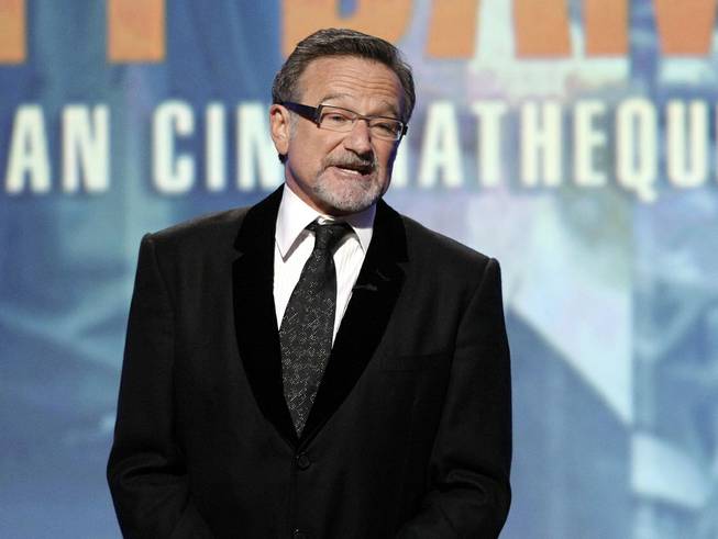 This March 27, 2010, file photo shows actor Robin Williams speaking at the 24th American Cinematheque Awards honoring Matt Damon in Beverly Hills, Calif. Williams has died in an apparent suicide. 