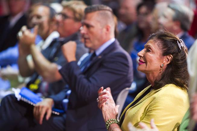 Former U.S. Congresswoman Shelley Berkley (D-NV) applauds during a news conference in the lobby of the Las Vegas Convention Center Tuesday, Aug. 12, 2014. The event celebrated the 50th anniversary of the Beatles concert in Las Vegas on August 20, 1964. Berkley went to see the concert with her parents, she said. A multi-media exhibition commemorating the event will be on display in the lobby of the LVCC through Oct. 27.
