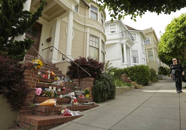 Mementos are left on the steps of a residence Tuesday, Aug. 12, 2014, in San Francisco, which was used in the film of "Mrs. Doubtfire," starring Robin Williams. Sheriff's officials say Williams committed suicide by hanging himself at his home in Tiburon, outside San Francisco. 