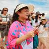 Chinese tourists take in the view at Grand Canyon West Tuesday, Aug. 12, 2014.