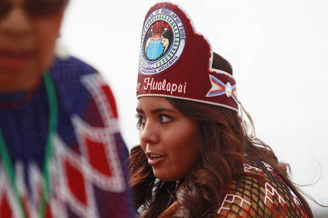 Miss Hualapai Elena Bravo performs a road blessing dance with the Hualapai Bird Dancers during the official opening of the newly paved section of Diamond Bar Road leading to Grand Canyon West Tuesday, Tuesday, Aug. 12, 2014.