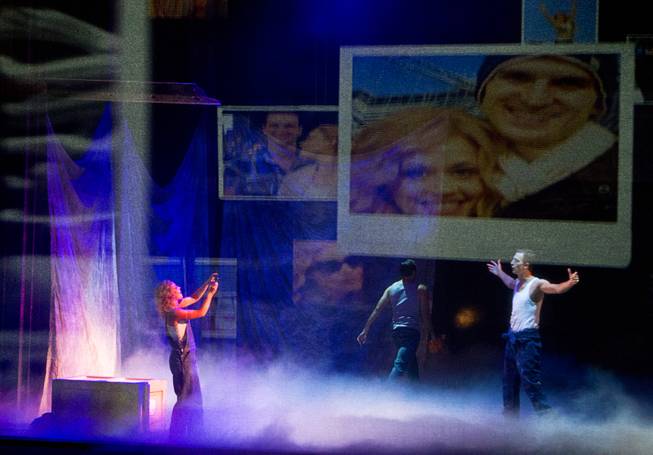 Molly (Katie Postotnik) takes a photo of Sam (Steven Grant Douglas) in their new apartment during “Ghost The Musical” at the Smith Center for the Performing Arts on Wednesday, Aug. 13, 2014, in downtown Las Vegas.
