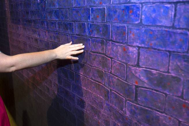 A "brick" wall is shown during a backstage tour of "Ghost The Musical" at the Smith Center for the Performing Arts Wednesday Aug. 13, 2014. The wall looks like brick from the audience but is actually made from a rubber roofing material. The musical runs through Sunday, Aug. 17.