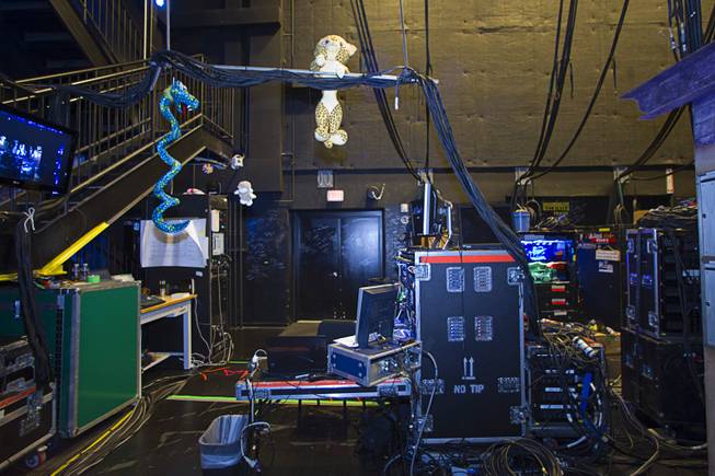 A stuffed animal hangs from cables by a video control center during a backstage tour of "Ghost The Musical" at the Smith Center for the Performing Arts Wednesday Aug. 13, 2014. The musical runs through Sunday, Aug. 17.
