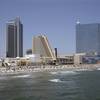 This Wednesday, July 23, 2014, photo shows casinos along the Atlantic City, N.J. boardwalk, from left, the Trump Taj Mahal Casino, with its Chairman Tower, the Showboat Casino Hotel and the Revel Casino Hotel.