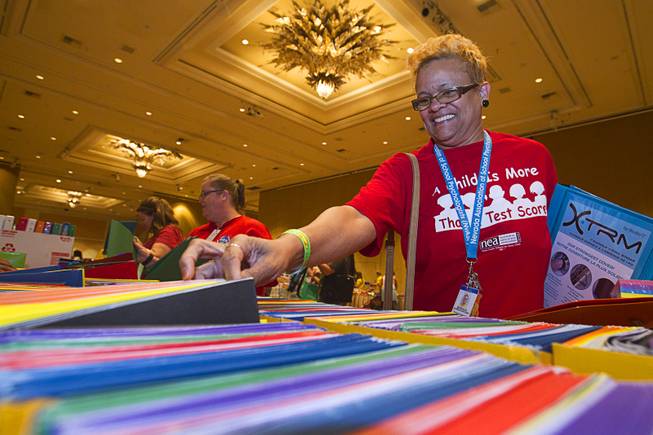 Bernava Johnson-Gafeney, a school psychologist, picks up free school supplies during MGM Resorts annual Educator Appreciation Day at the Mirage Thursday Aug. 14, 2014. In addition to school supplies provided by MGM Resort employees, a variety of agencies participated in the days activities to introduce educators to teaching resources available in the community.